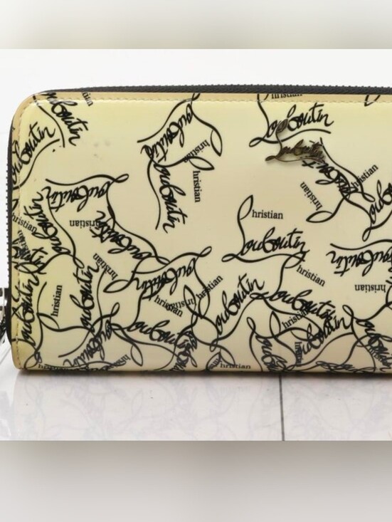 Christian Louboutin Handbags - Christian Louboutin Cream Wallet with Black Script/ EUC